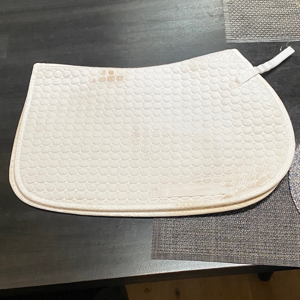Used but good condition white all purpose saddle pad